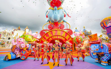 Performers in colorful costumes at Elephant in the Room, Carnival Magic, Phuket.