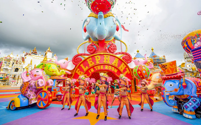 Performers in colorful costumes at Elephant in the Room, Carnival Magic, Phuket.