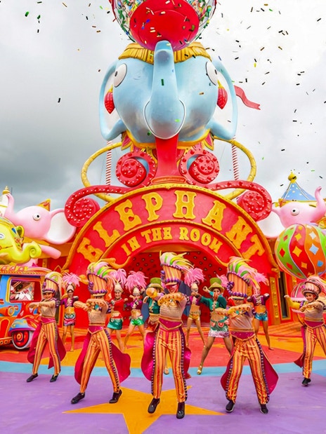 Performers in colorful costumes at Elephant in the Room, Carnival Magic, Phuket.