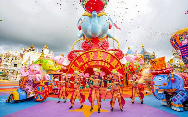 Performers in colorful costumes at Elephant in the Room, Carnival Magic, Phuket.