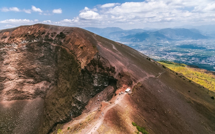 Hiking trail along the crater of Mount Vesuvius, Italy, with panoramic views.