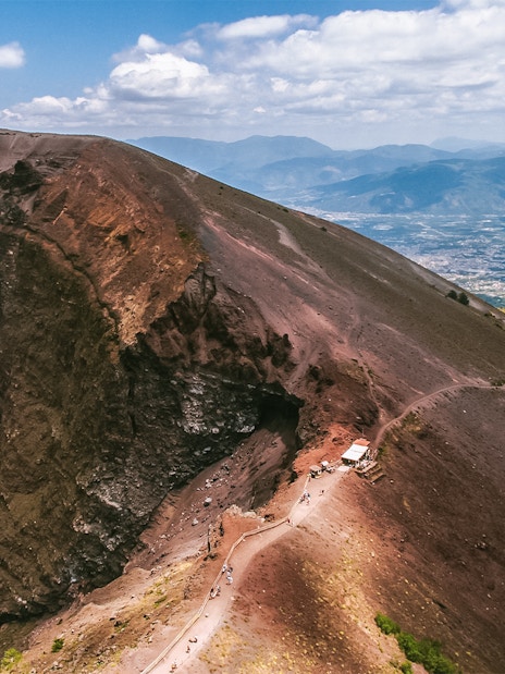 Hiking trail along the crater of Mount Vesuvius, Italy, with panoramic views.