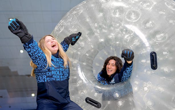 Guests enjoying Zorbing experience at Ski Dubai.