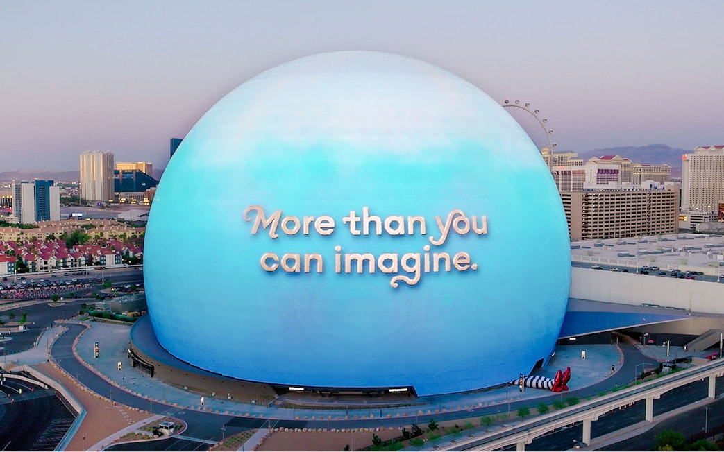Sphere in Las Vegas with "More than you can imagine" text, Wizard of Oz theme.