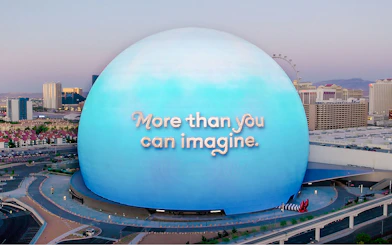 Sphere in Las Vegas with "More than you can imagine" text, Wizard of Oz theme.