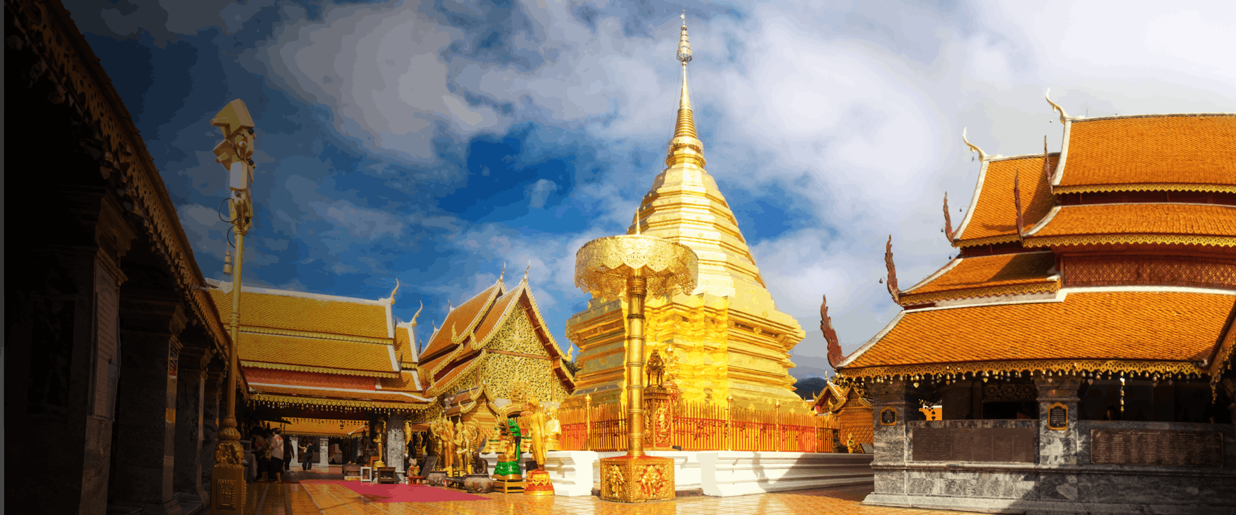 Golden pagoda and temple buildings at Wat Phra That Doi Suthep, Chiang Mai, Thailand.