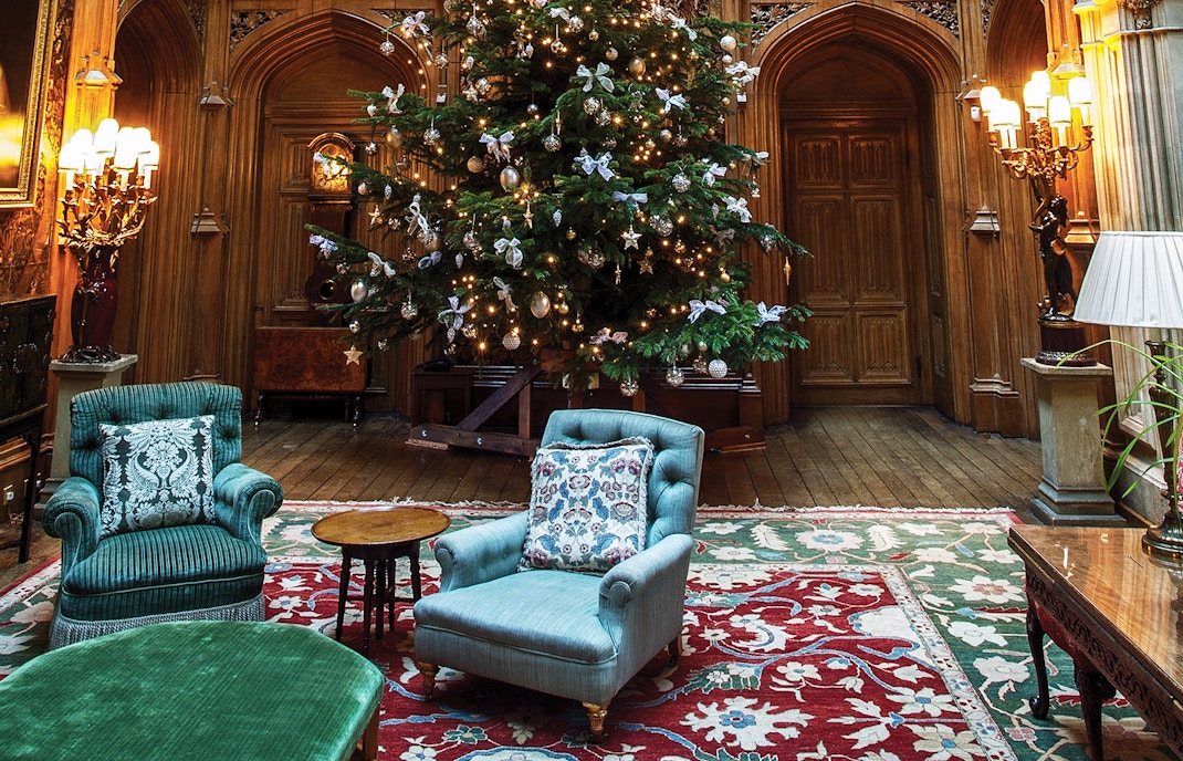Visitors exploring the grand Highclere Castle, iconic setting of Downton Abbey, in Hampshire, England.