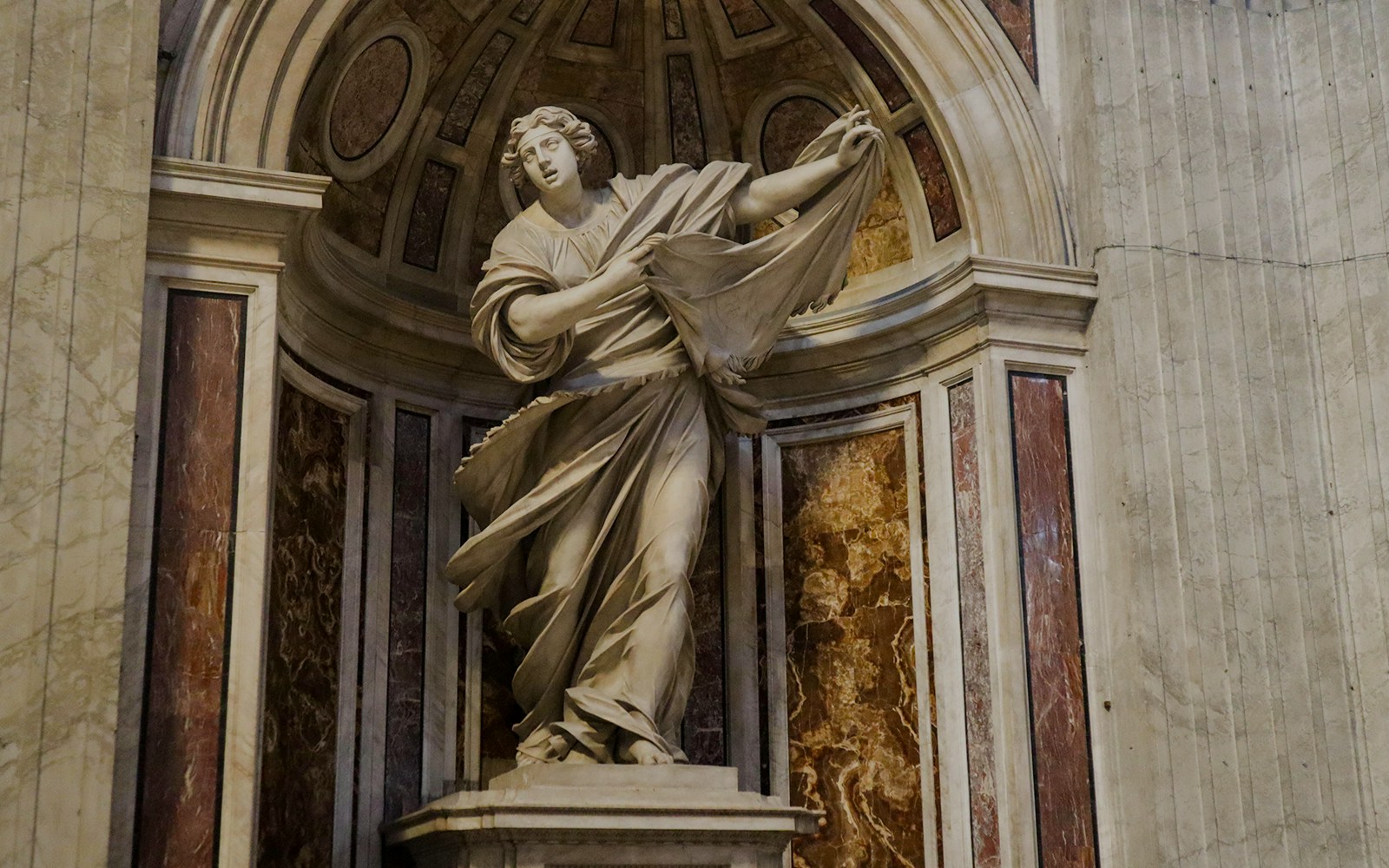 Statue of Veronica holding the Veil, a significant landmark inside St. Peter's Basilica, Rome