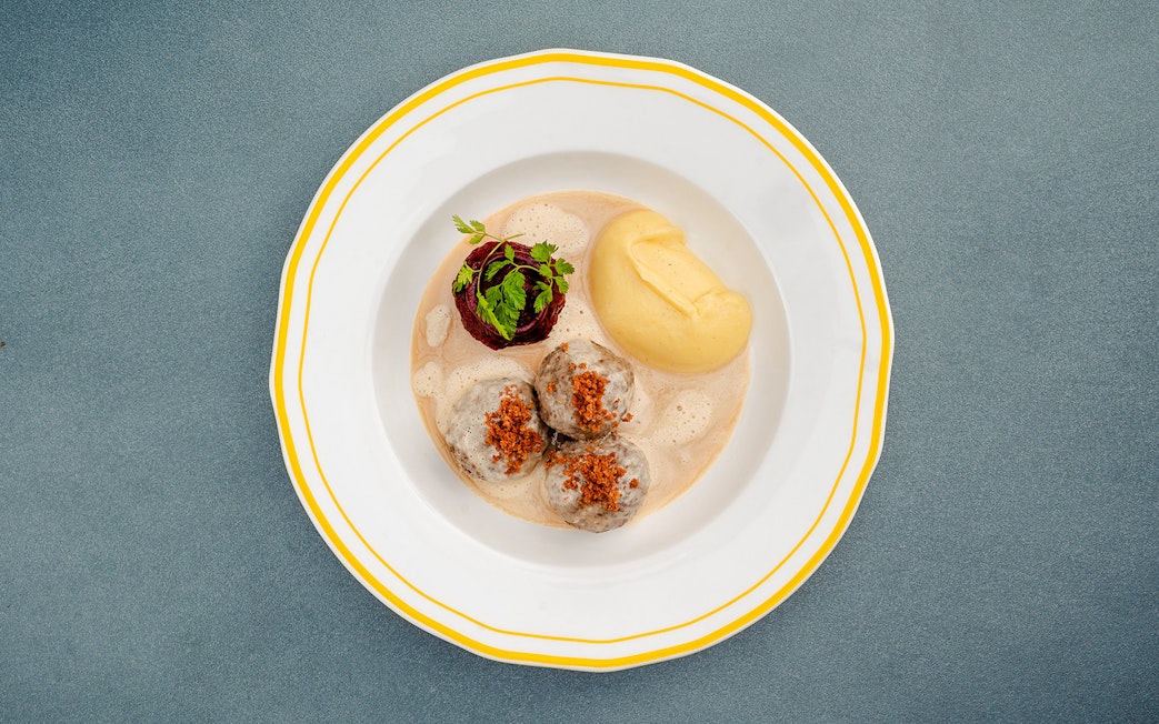 German meatballs with mashed potatoes and garnish, Berlin.