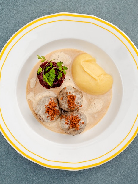 German meatballs with mashed potatoes and garnish, Berlin.