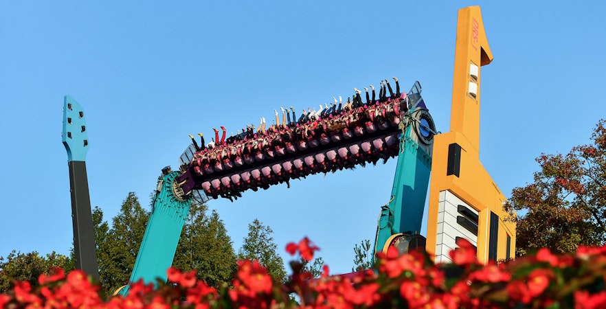 Riders on a colorful thrill ride at Everland Theme Park, South Korea.