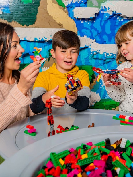 Family building LEGO creations at LEGOLAND® Windsor Resort.