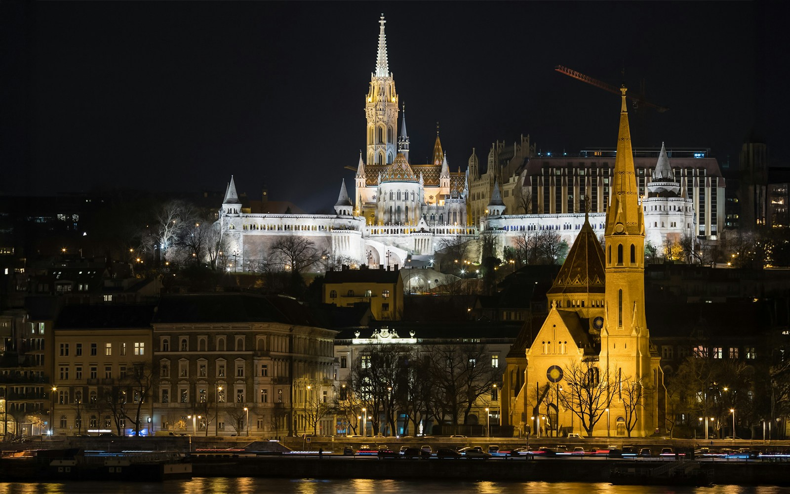 Fisherman's Bastion view from Danube River evening cruise with live music in Budapest.