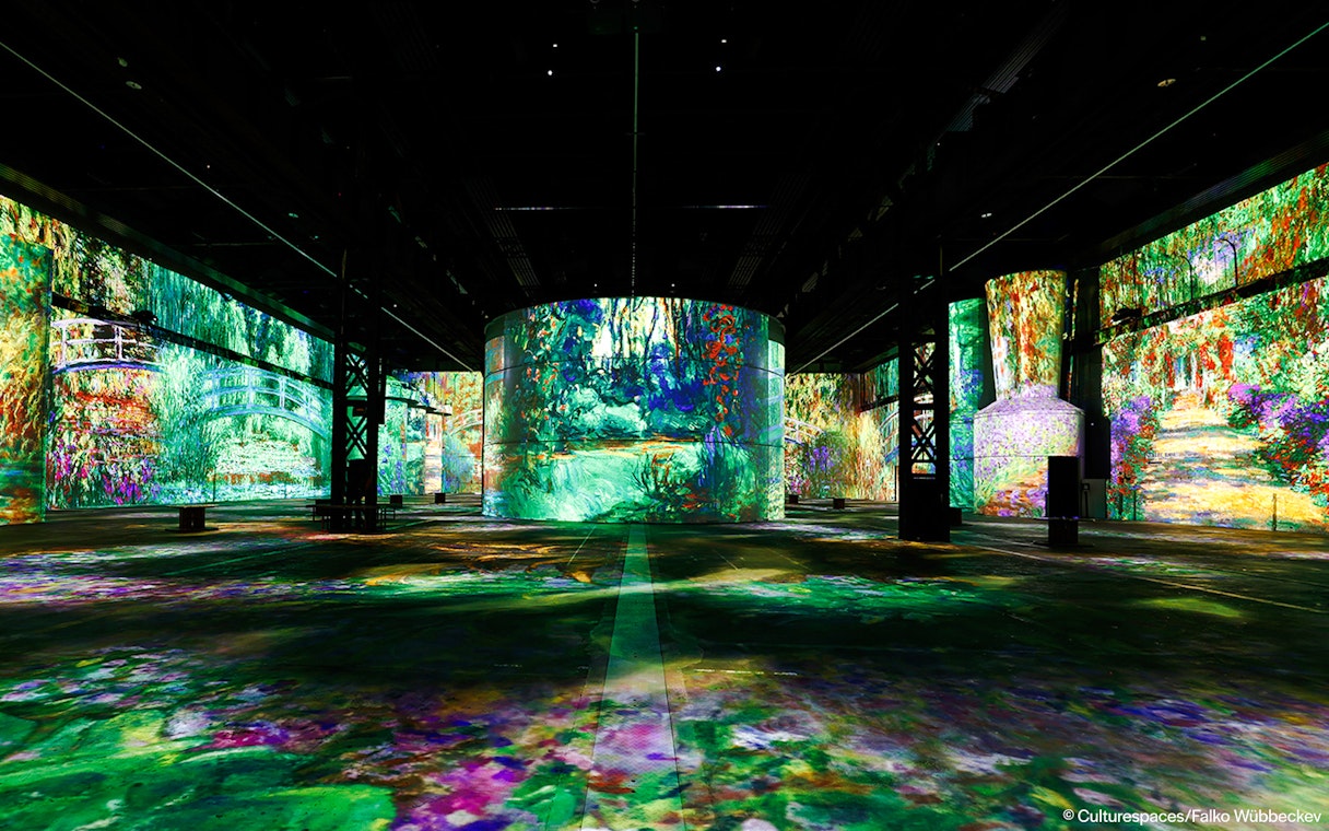 Immersive art projections at Phoenix des Lumières exhibit.