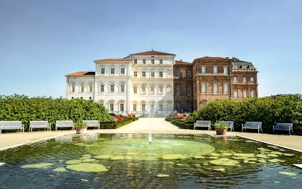 Palace of Venaria with fountain and gardens in foreground, Turin, Italy.