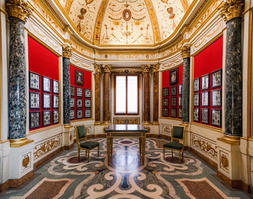 Visitors viewing Renaissance art in the Uffizi Gallery, Florence, Italy.
