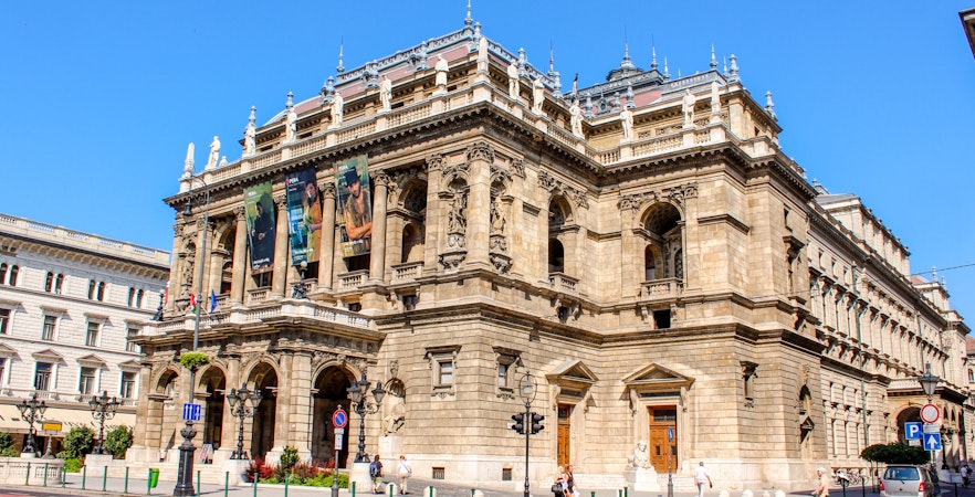 Facade of the Hungarian State Opera in Budapest with ornate architecture.