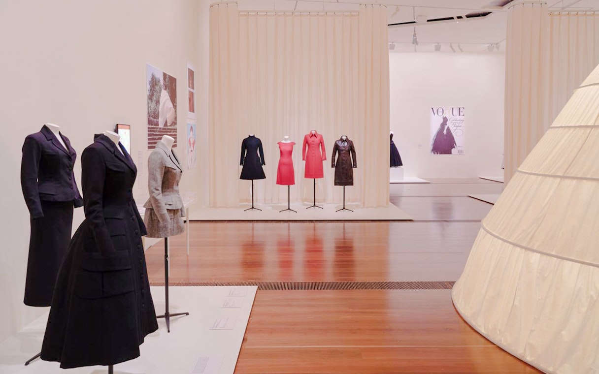 Mannequins displaying Martin Grant fashion exhibits in a gallery setting.