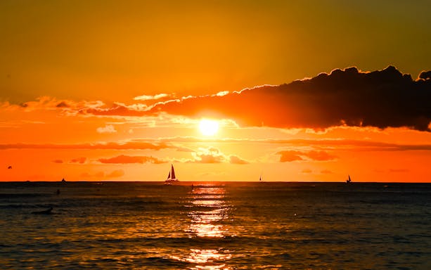 Sailboats on Waikiki Beach at sunset, Honolulu, Oahu, Hawaii.