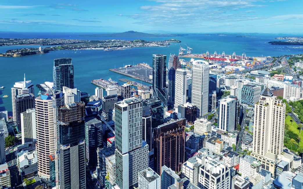 Auckland skyline and financial district viewed from Sky Tower with harbor in background.