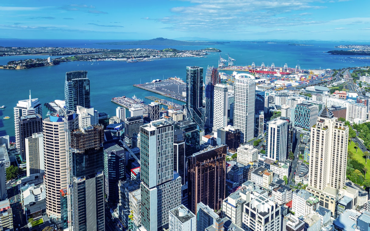 Auckland skyline and financial district viewed from Sky Tower with harbor in background.
