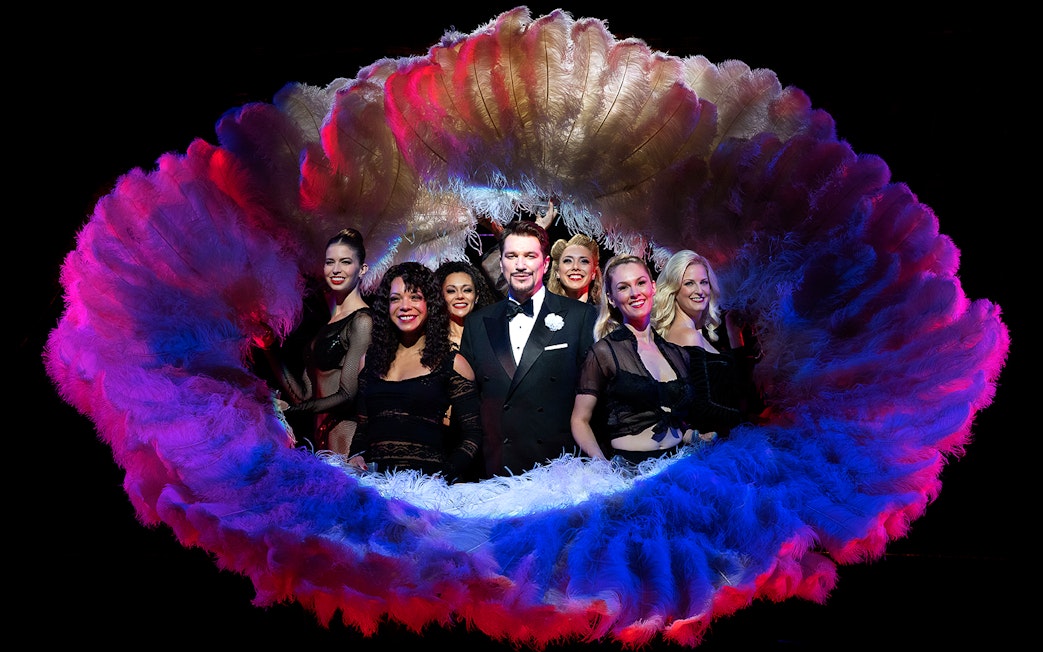Cast of Chicago musical performing with feather fans, New York.