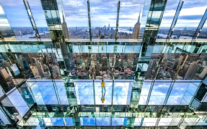 Observation deck view from SUMMIT One Vanderbilt, showcasing New York City skyline and mirrored reflections.