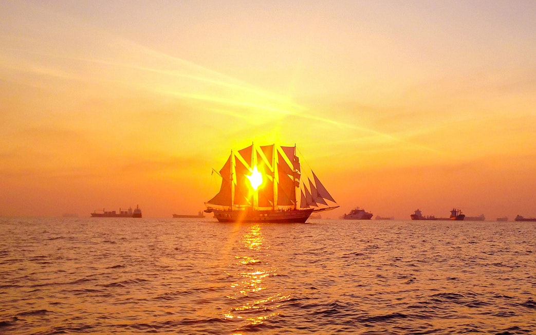 Sailing ship at sunset during the Royal Albatross dinner cruise.