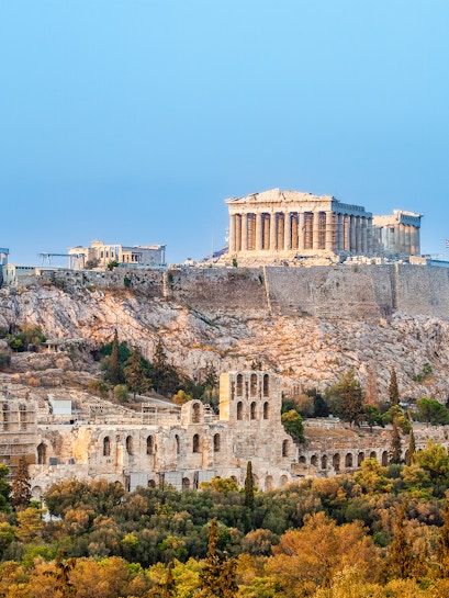 Acropolis in Athens with Parthenon and ancient ruins on a hilltop.