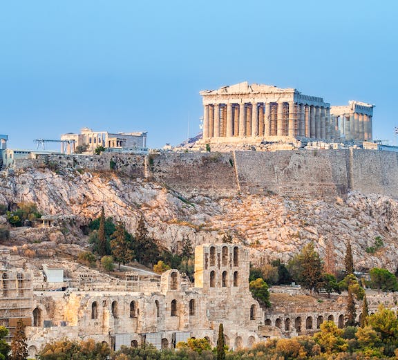 Acropolis in Athens with Parthenon and ancient ruins on a hilltop.