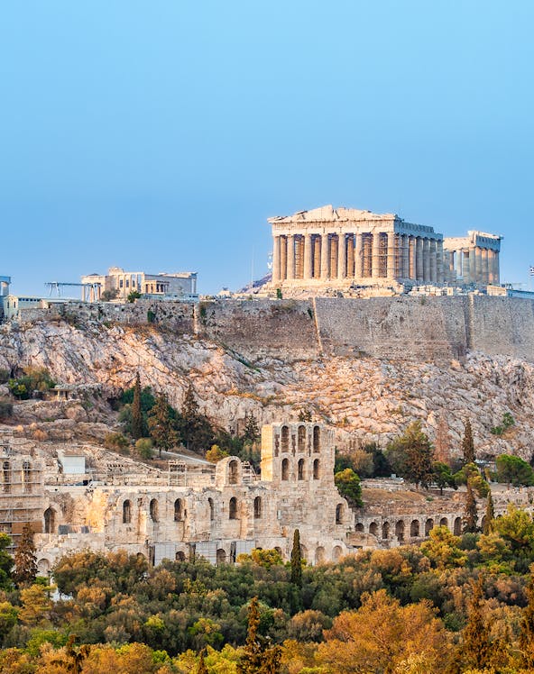 Acropolis in Athens with Parthenon and ancient ruins on a hilltop.