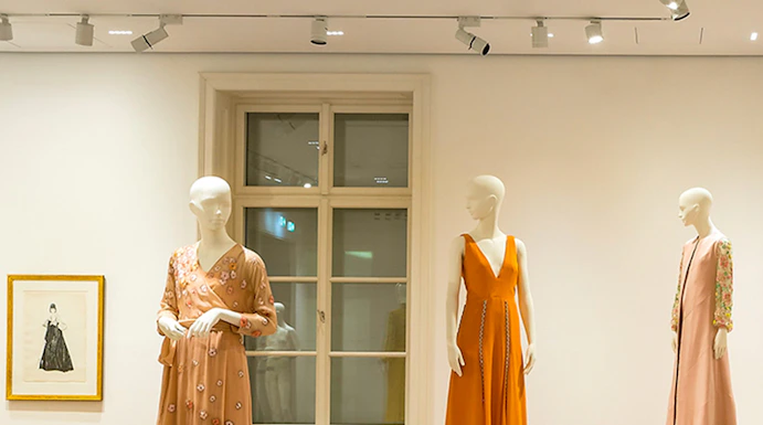 Mannequins displaying elegant dresses at the Heidi Horten Collection exhibition.