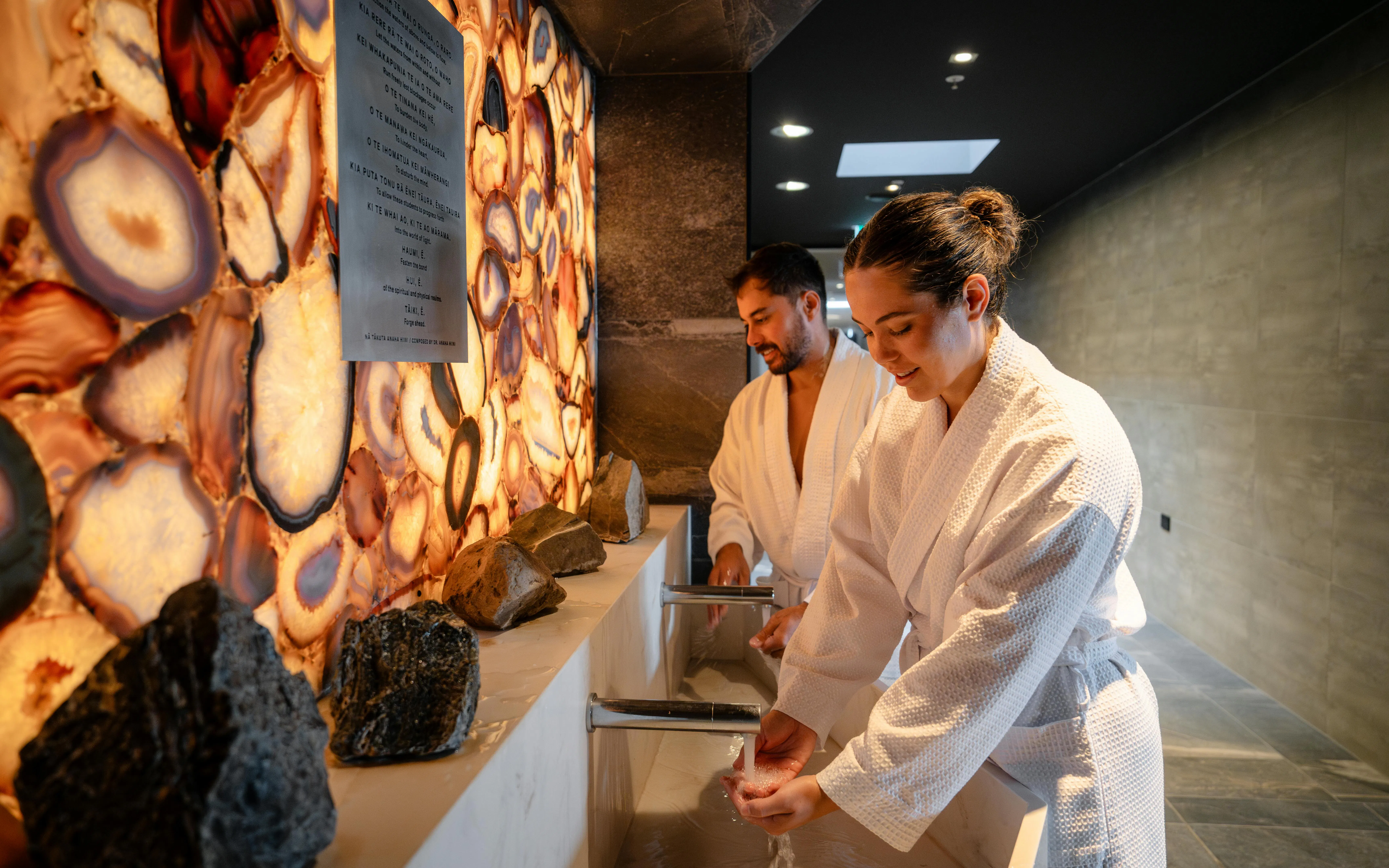 Guests performing a ritual handwashing at Wai Ariki Hot Springs & Spa, Rotorua.