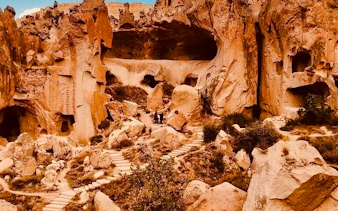 Ancient rock formations and pathways in Cappadocia, part of the Red Tour.