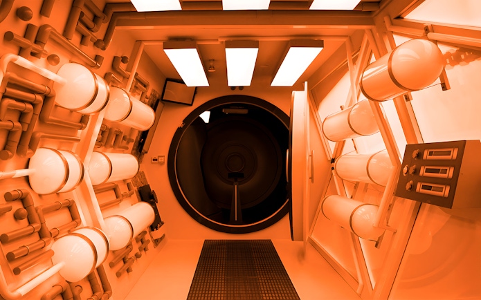 Futuristic exhibit at Science Centre Singapore featuring a tunnel with illuminated panels.