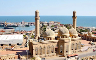 Gobustan and Absheron tour view with mosque and Caspian Sea in Baku.