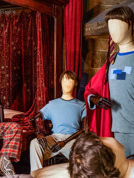 Mannequins in wizard attire at the Magical Mischief exhibit.