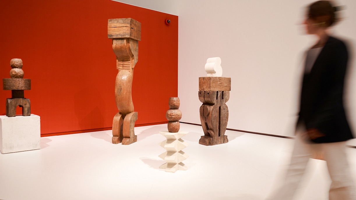 Wooden sculptures on display at H’ART Museum exhibit.