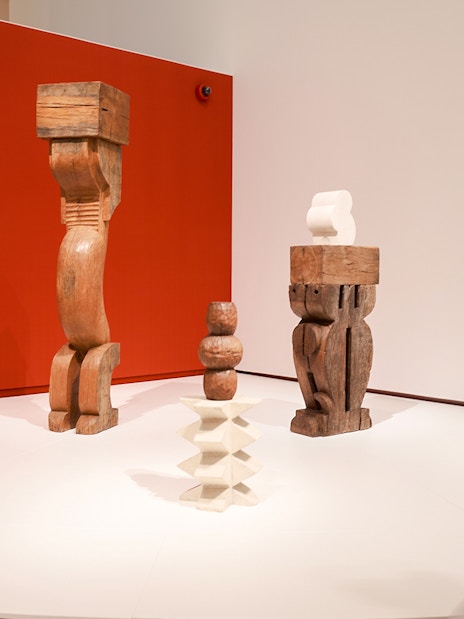 Wooden sculptures on display at H’ART Museum exhibit.