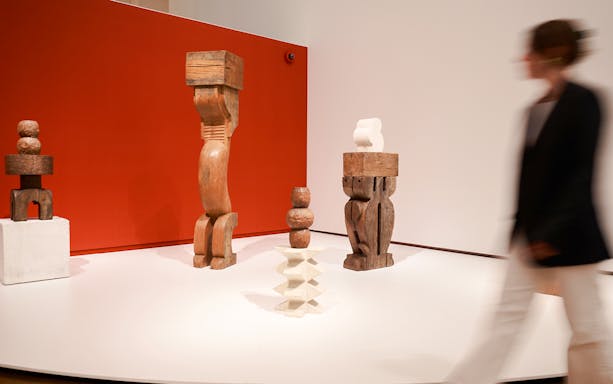 Wooden sculptures on display at H’ART Museum exhibit.