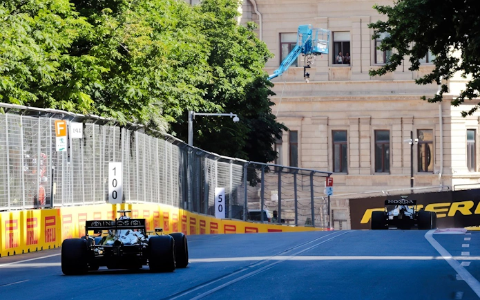 Formula 1 cars racing on a street circuit in Baku, Azerbaijan Grand Prix 2026.