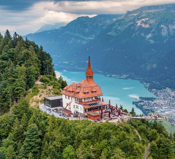 Harder Kulm viewpoint overlooking Lake Brienz and mountains in Interlaken, Switzerland.