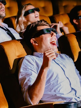 Visitors enjoying a 4D experience at Sentosa 4D AdventureLand, wearing 3D glasses.