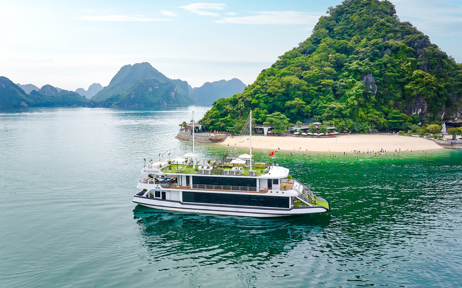 Cruise ship Hercules Premium near a scenic island in Halong Bay, Vietnam.