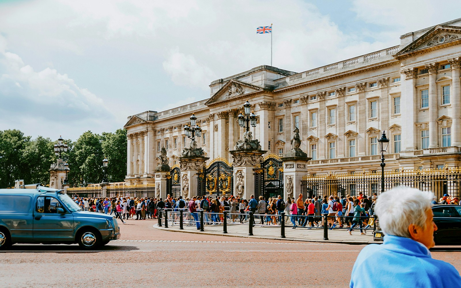 Crowd outside Buckingham Palace gates in London.