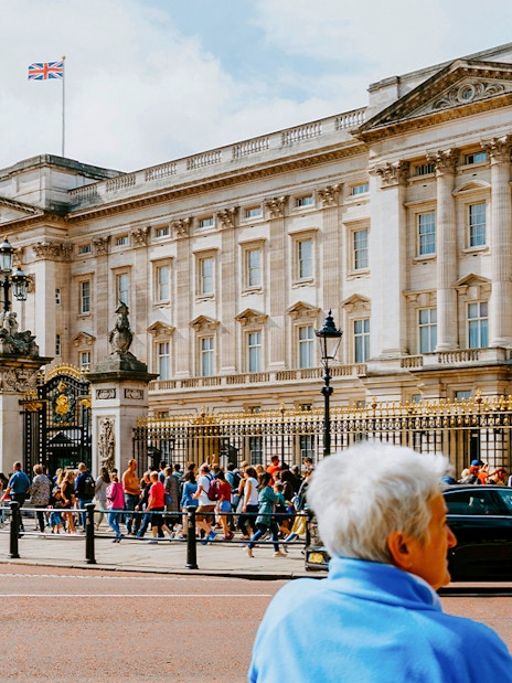 Crowd outside Buckingham Palace gates in London.
