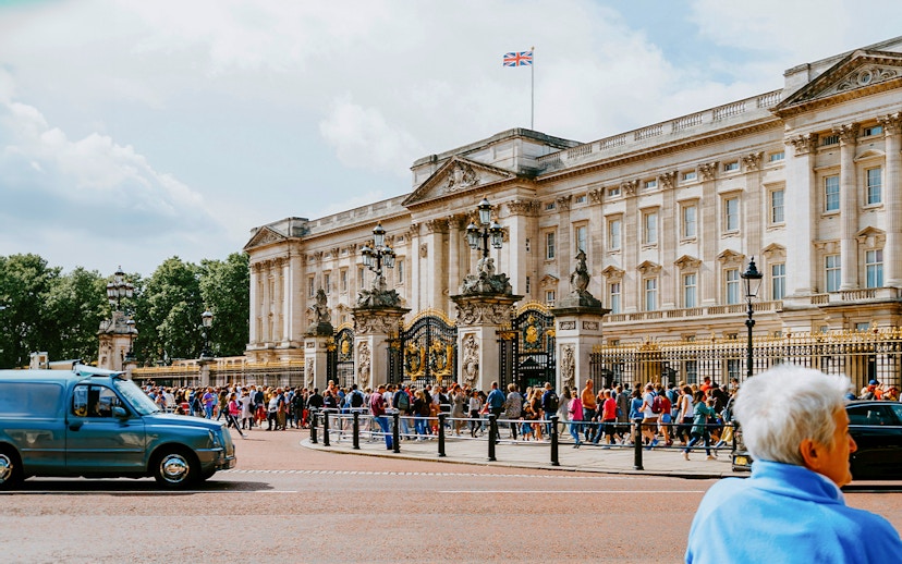 Crowd outside Buckingham Palace gates in London.