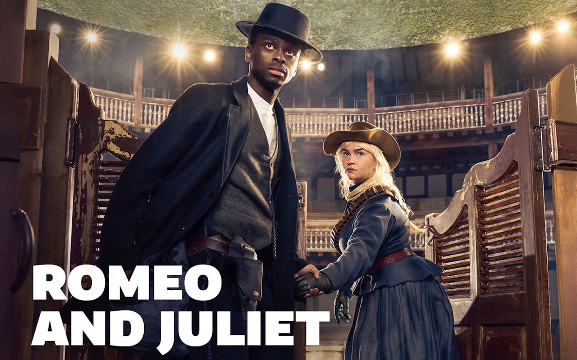 Actors in period costumes on stage for "Romeo and Juliet" at a theater.