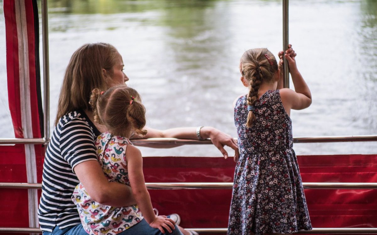 Family enjoying York sightseeing cruise on a riverboat.