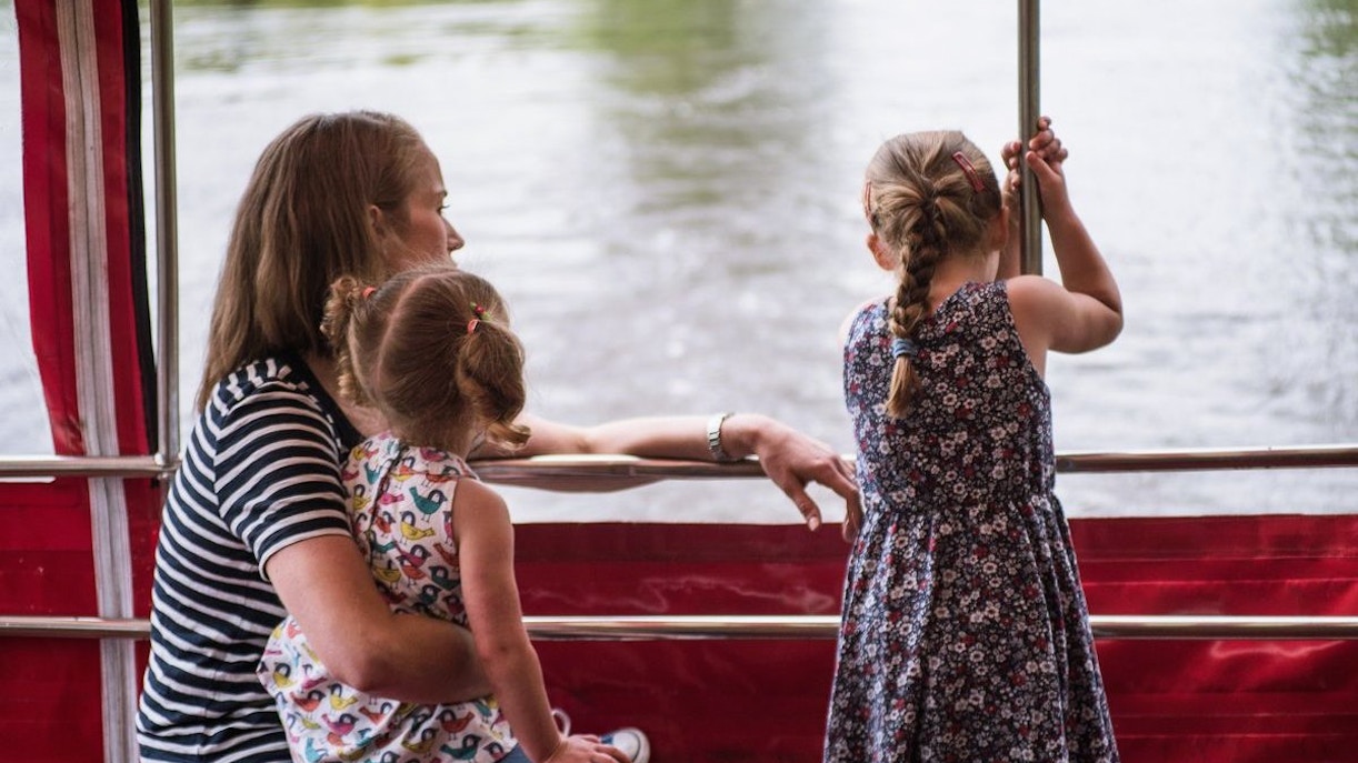 Family enjoying York sightseeing cruise on a riverboat.